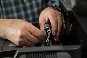 copier tech working on a copy machine